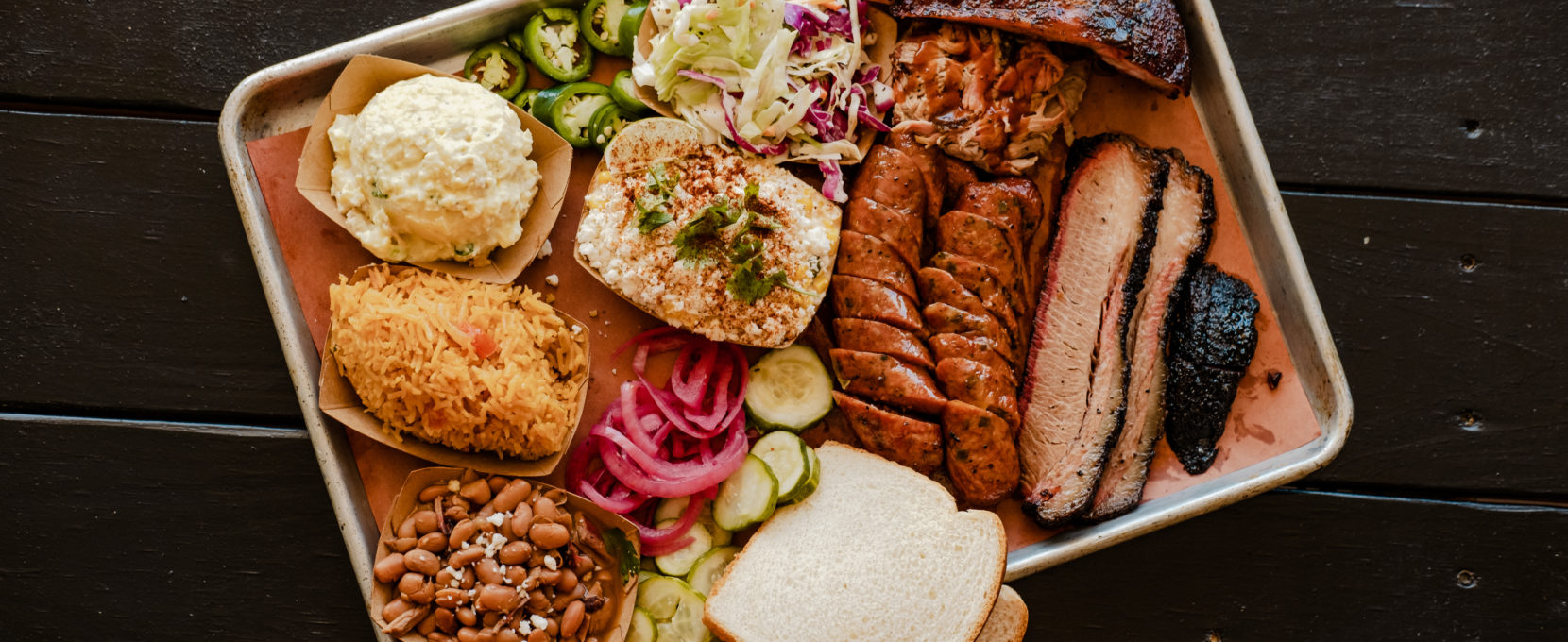 A spread of barbecue and sides from Butters BBQ is located in Sinton, Texas.