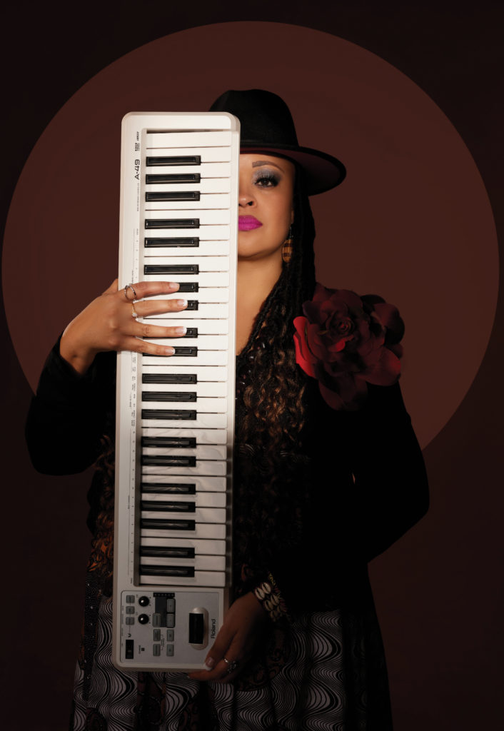 Corpus Christi musician Claudia Melton poses with her keyboard. 