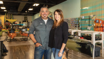 Fin Factory owner Mike Morales and wife stand in Fin Factory store.