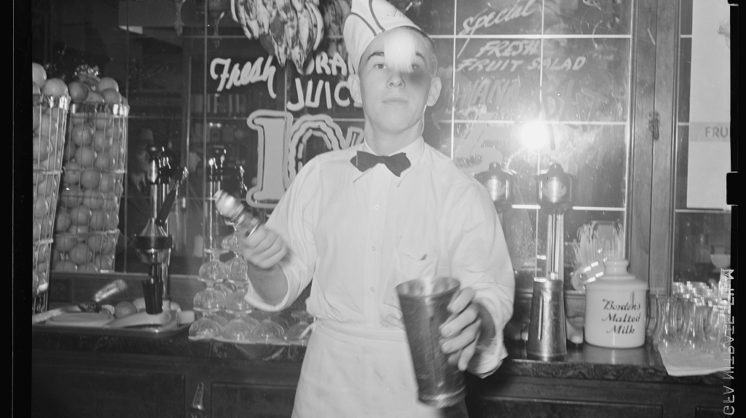 Famed photographer Russell Lee captured a soda jerk flipping ice cream into malted milkshakes at one Corpus Christi soda fountain, February 1939.
