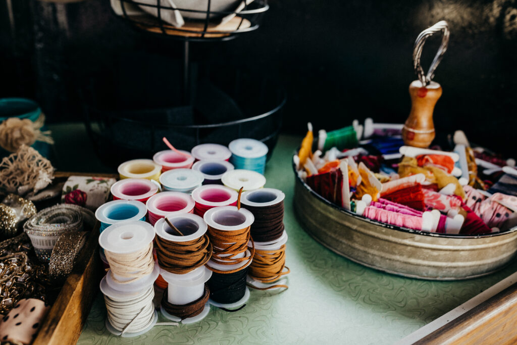Thread sits on the table of The Hat Bar Co.'s mobile pop-up shop.