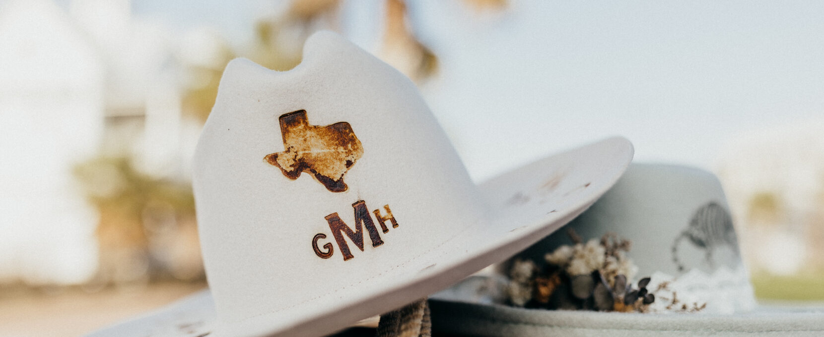 Two custom hats from The Hat Bar Co. in Corpus Christi, Texas.