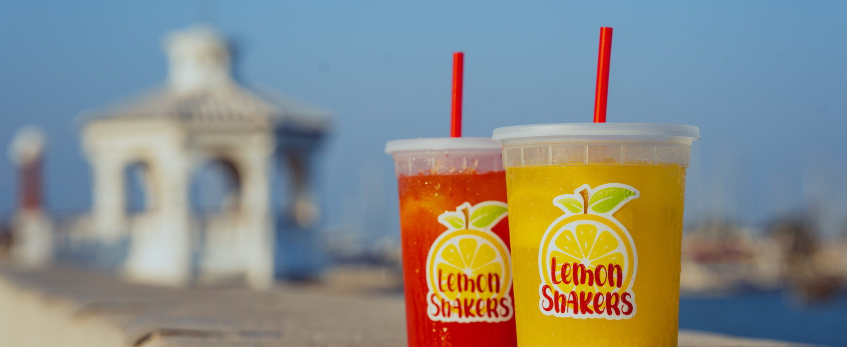 Fresh squeezed classic and strawberry lemonade from Lemon Shakers sit on the steps of the Corpus Christi seawall.
