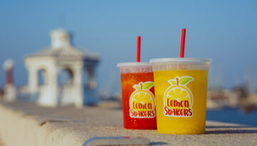 Fresh squeezed classic and strawberry lemonade from Lemon Shakers sit on the steps of the Corpus Christi seawall.