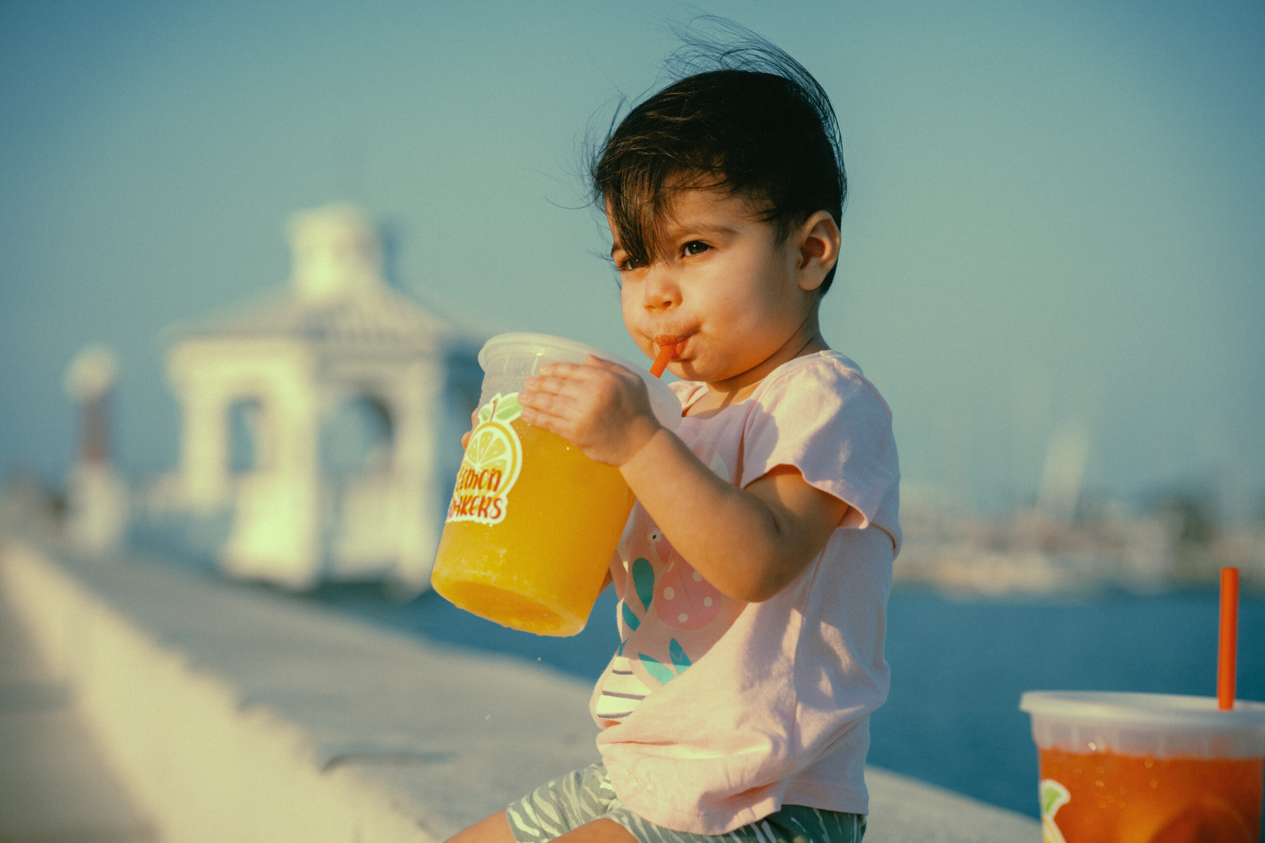 Photographer Levi Guzman's daughter enjoying the fresh and delicious lemonade from Lemon Shakers along the Corpus Christi seawall.