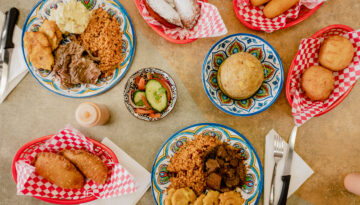 A table at El Taino with a variety of savory dishes, bringing a taste of Puerto Rico to Corpus Christi's South Side.