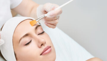Shutterstock image of woman receiving a Now Experiencing: Faux-tox Facial.