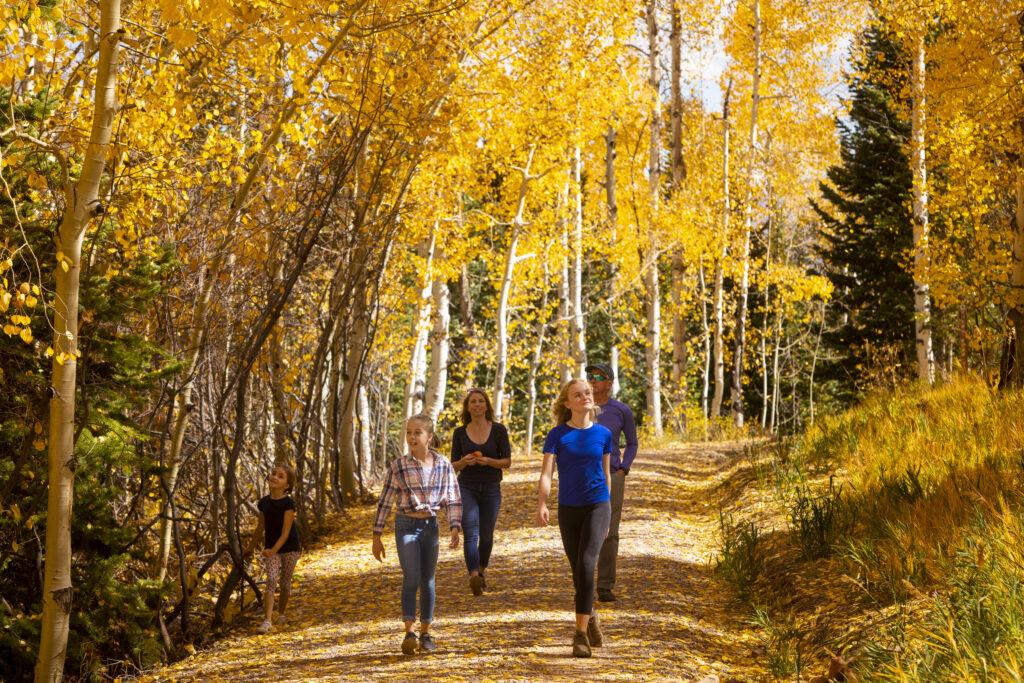 A family on a fall hike in Snowmass, Colorado. 