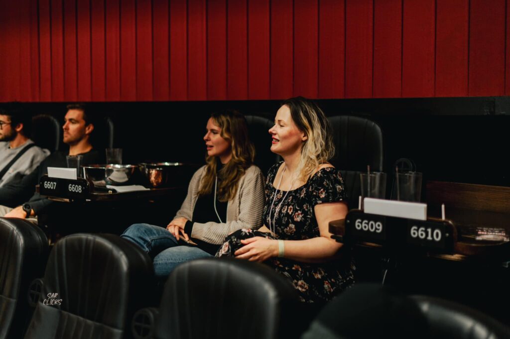 South Texas Underground Film Festival attendees sit inside a theatre at Alamo Drafthouse. 