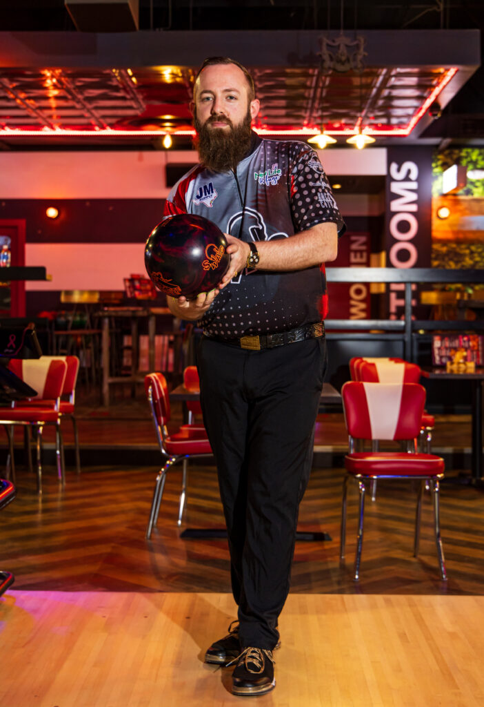 Colton Bartel, a PBA player, sits inside a bowling alley in Corpus Christi, Texas and poses for a photo.