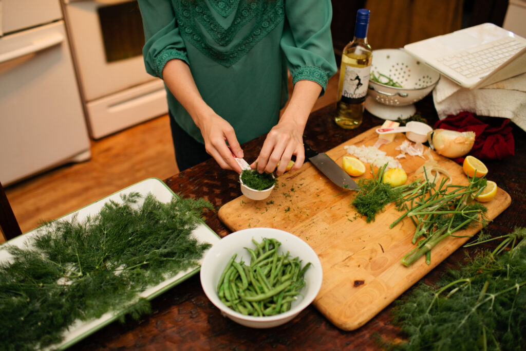 Kayla Butts prepares baked whole snapper in the June 2014 Farm to Table recipe.