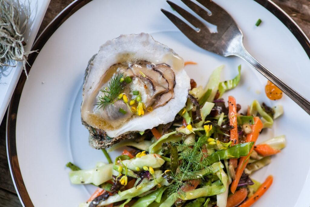 Grilled oysters and kale slaw recipe from The Bend's Farm to Table archives.