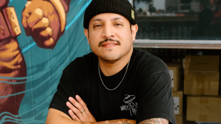 Photo of Martin Flores, owner of Marty McPies, in front of his new restaurant