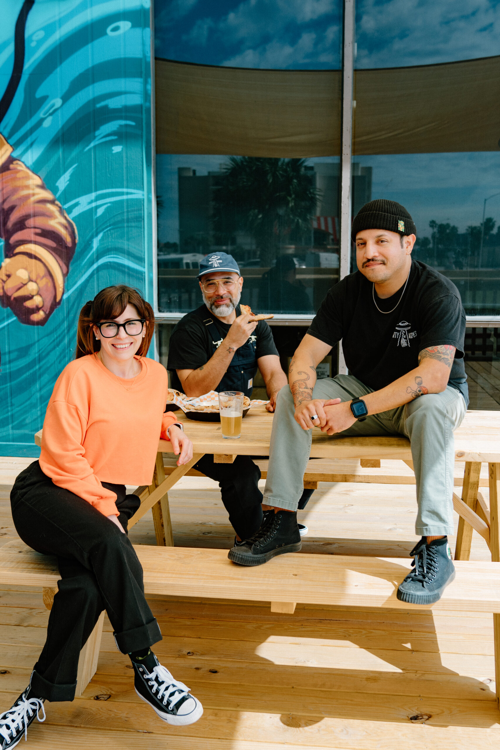 a photo of the staff from Marty McPies posing in front of the new restaurant