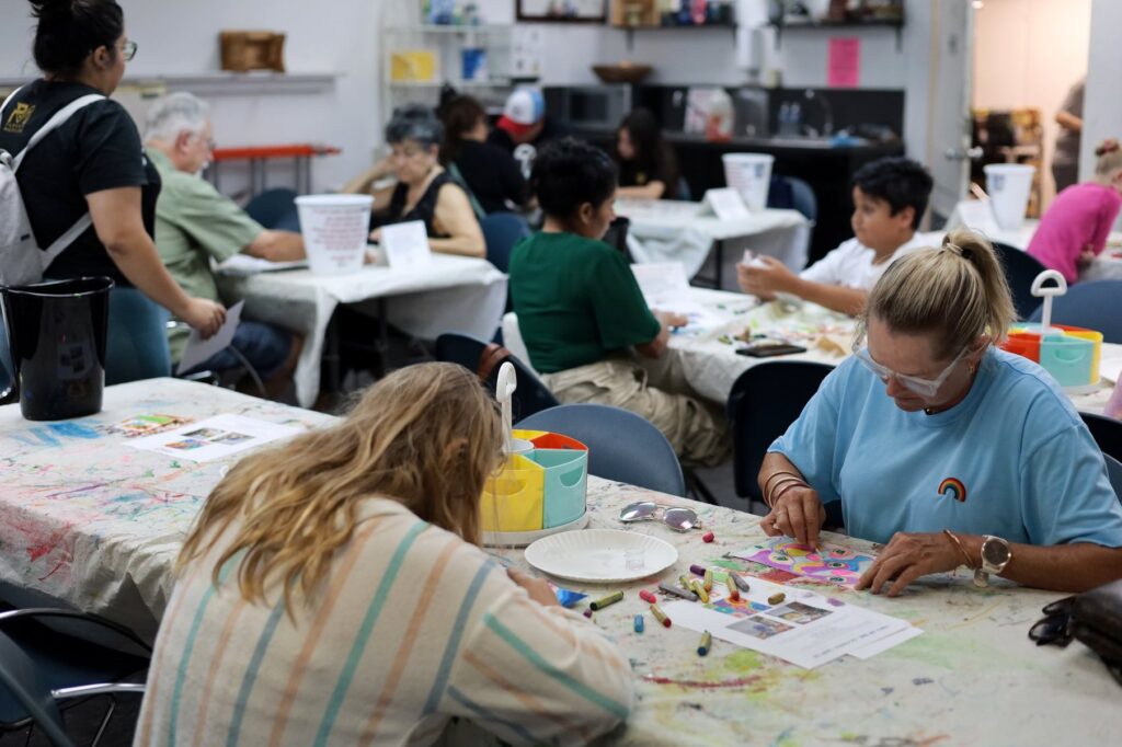 A group indulges in arts and crafts during the Art Centers weekly free Family Art Time in Corpus Christi, Texas