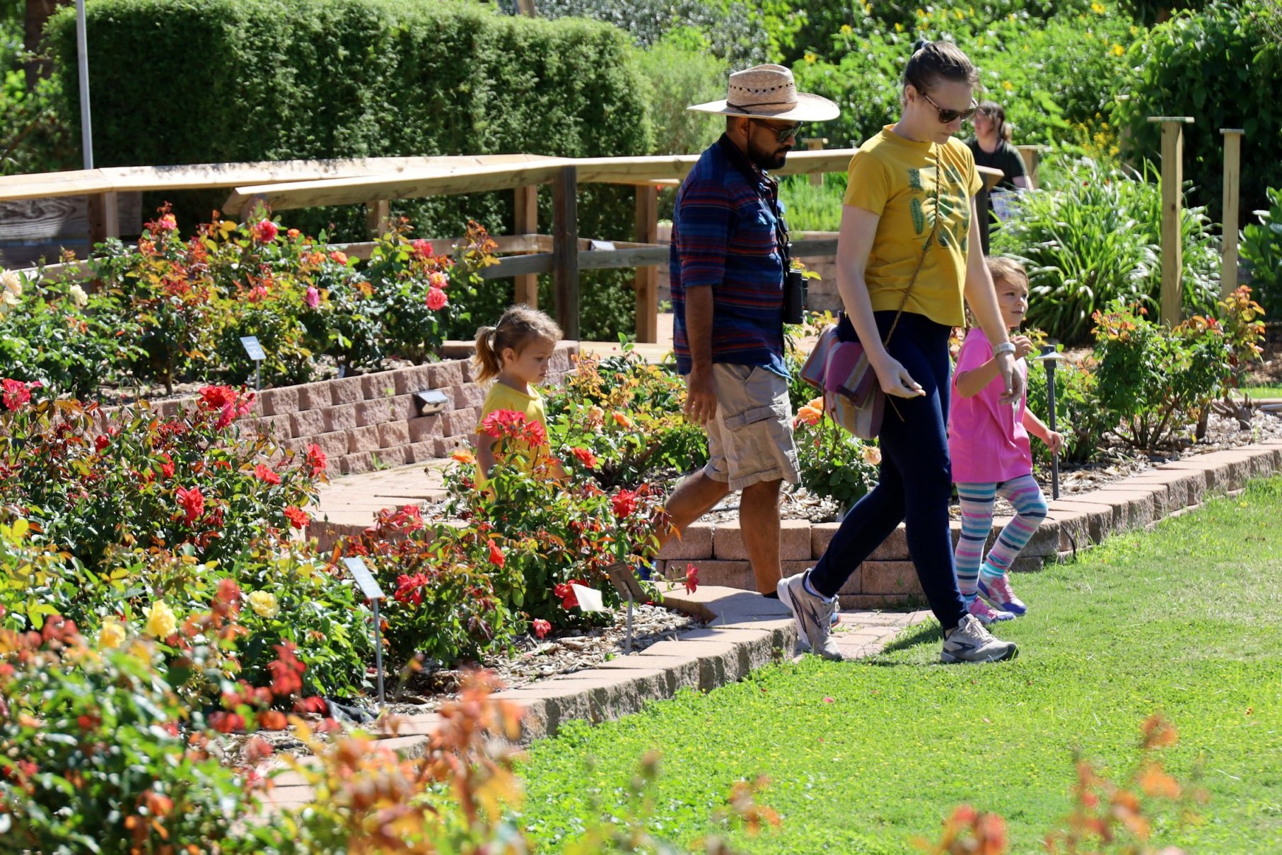 A family enjoys an afternoon at the Corpus Christi Botanical Gardens.