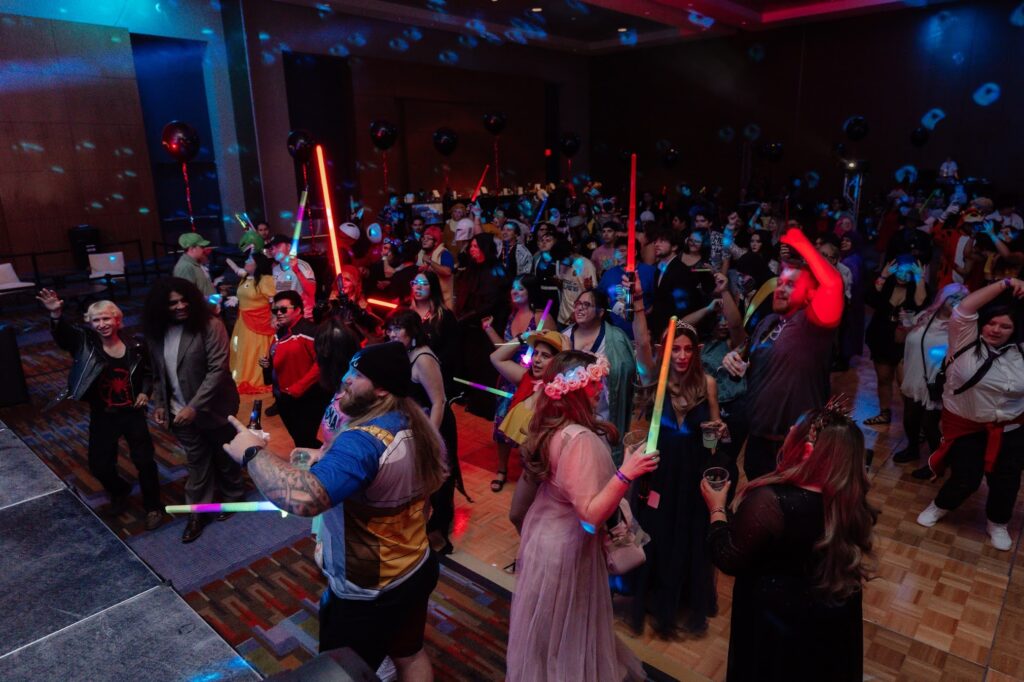 Event goers dressed in cosplay dance at the 2023 Corpus Christi Comic Con's Nerd Prom.
