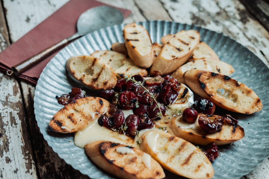 Grilled Brie with Marinated Grapes on Baguette