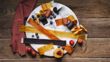 Homemade fruit roll ups on a plate to show a recipe.