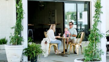 A family and their dog on the patio at BUS in downtown Corpus Christi.