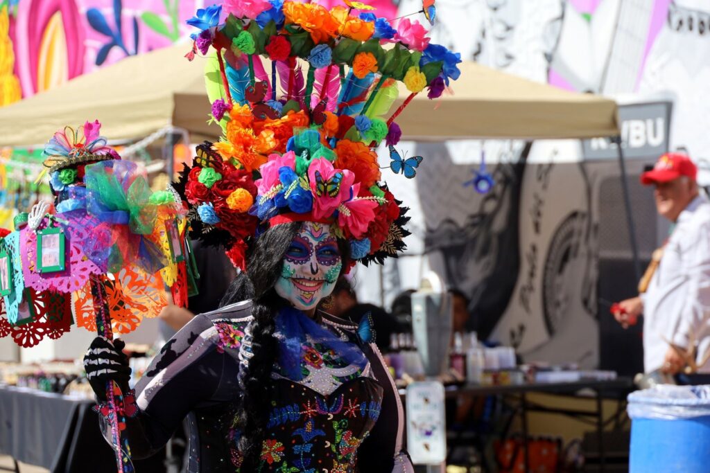 A woman dressed up in traditional attire for Corpus Christi's Dia de los Muertos festival.