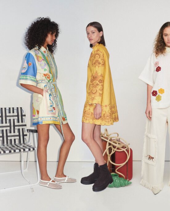 Three women pose for a photo for the brand ALÉMAIS.