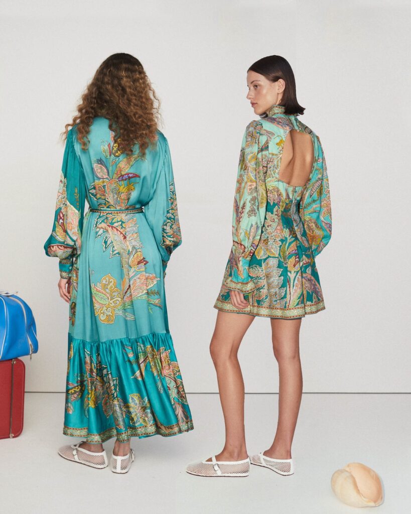 Two women posing in clothing from the Australian brand ALÉMAIS. 