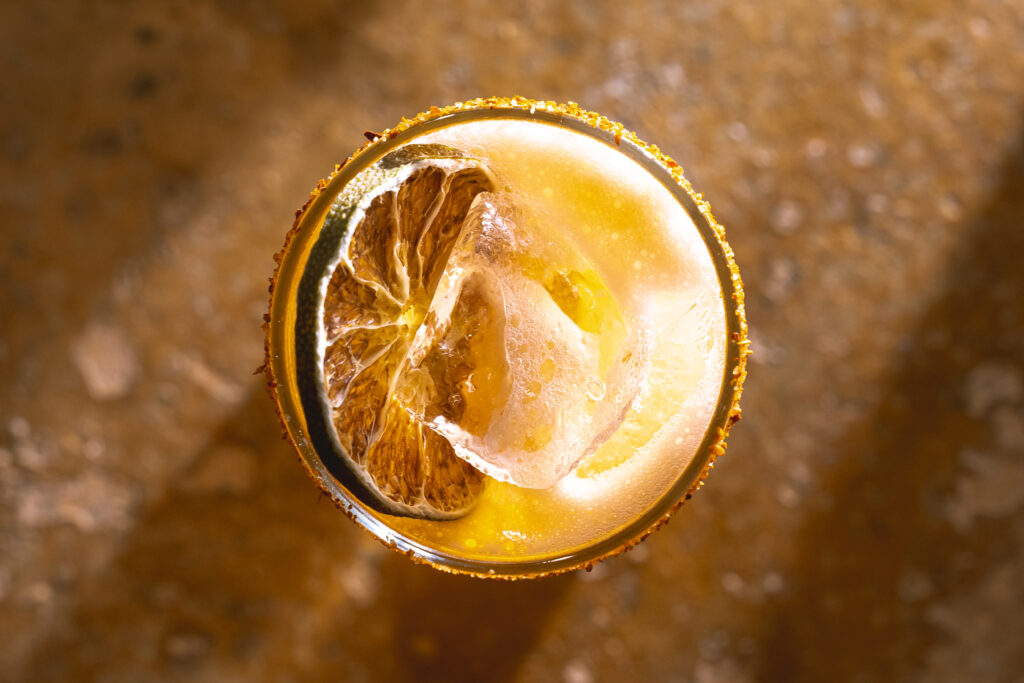 An overhead shot of an orange cocktail from The Post at Lamar Park in Corpus Christi. 