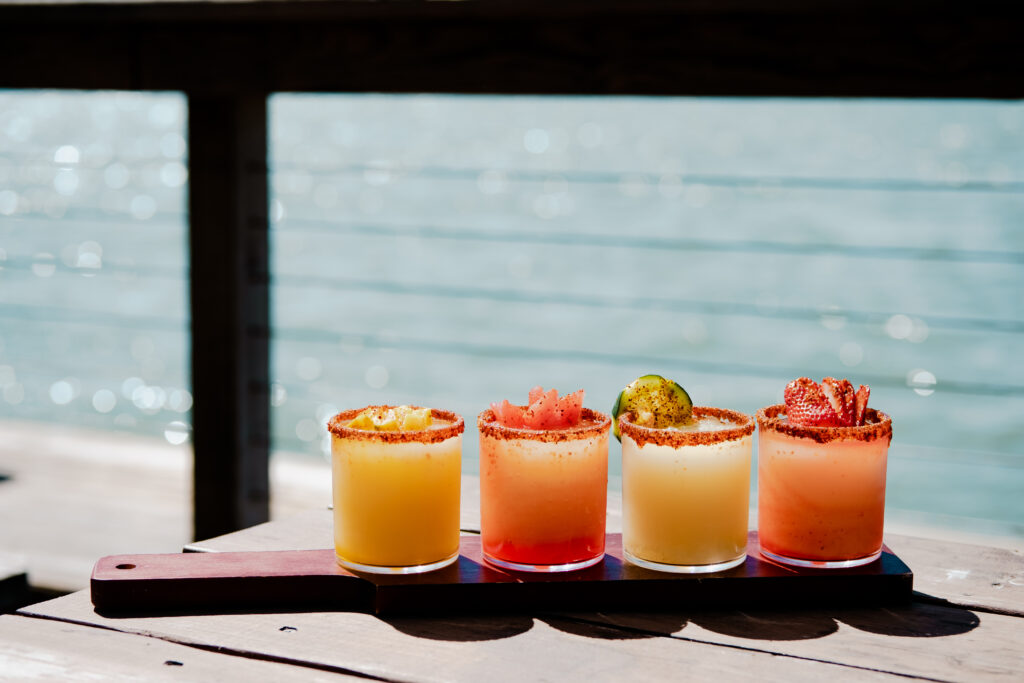 Four margaritas lined up on a table at The Waterline at Doc's in Corpus Christi. 