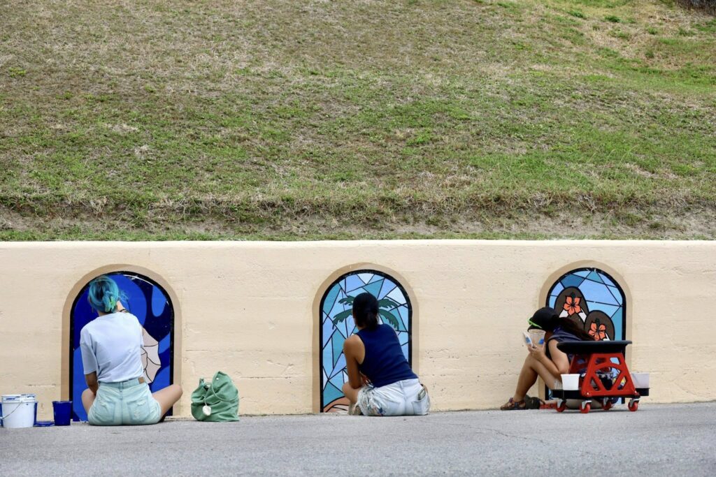 Local artists paint a mural with K Space Contemporary for Mural Fest 2025 in Corpus Christi, Texas.