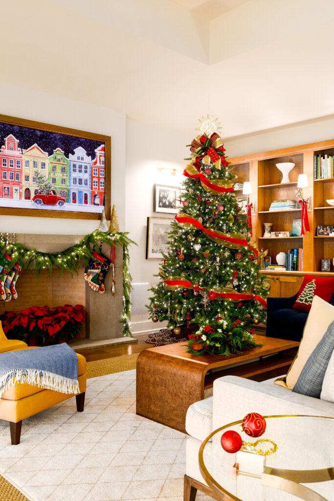 Stuart and Shannon White's living featuring a decorated fireplace, a Christmas tree and furniture for the December 2025 Open House feature.