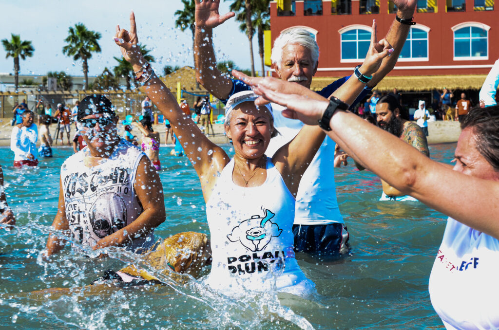 A group of people in the water at the Corpus Christi Polar Bear Plunge. 