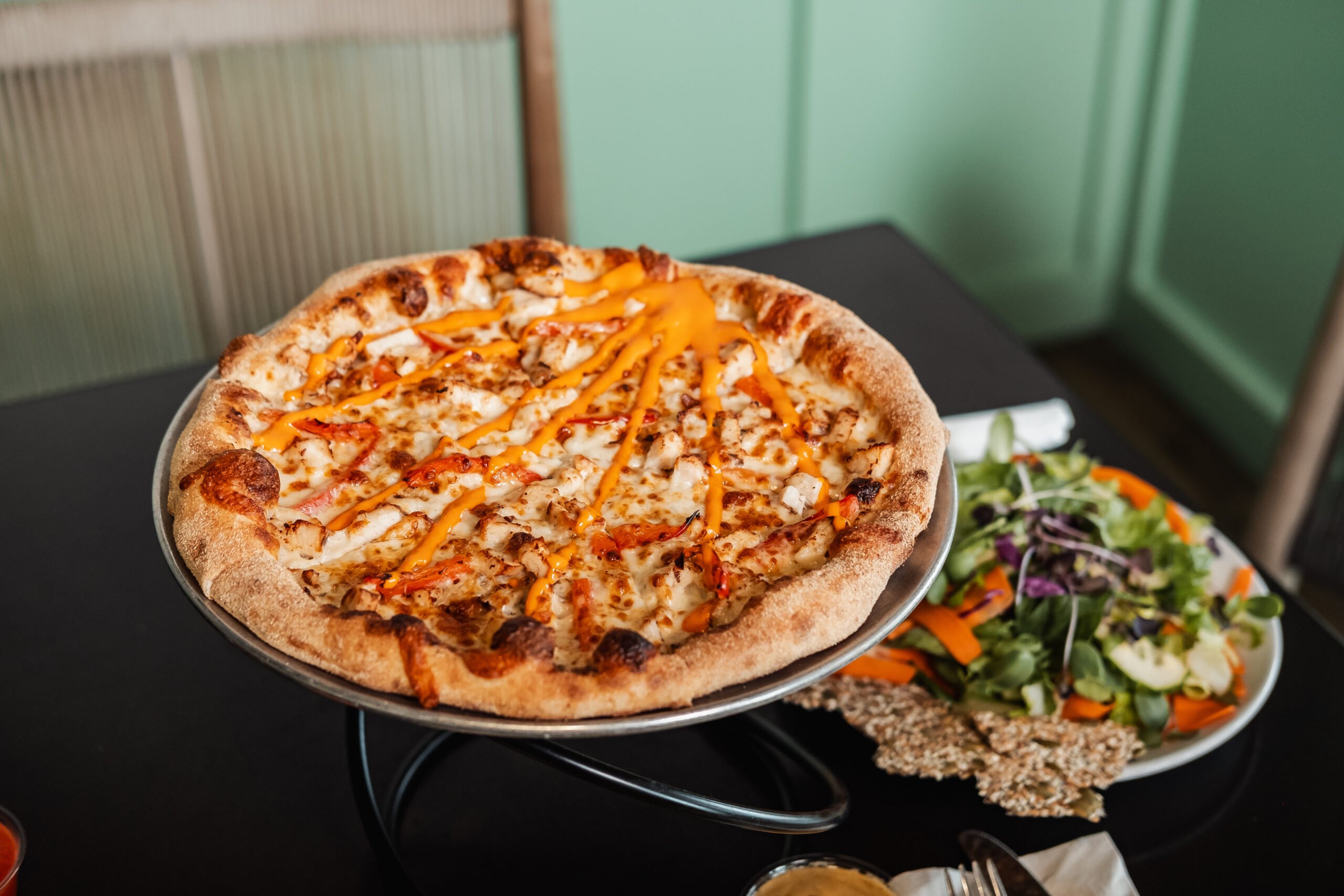 A close up of the Honeyfire pizza from Saucy Mama's.