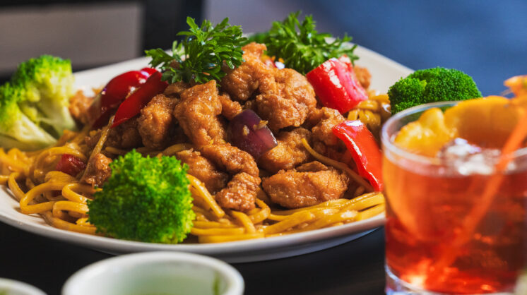 A close up image of one of Kapi Honda's signature dishes and cocktail.