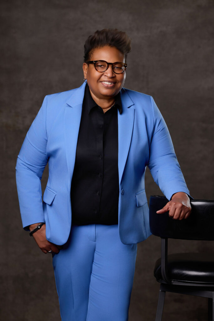 Deanna King, President of the NAACP Corpus Christi Chapter poses in a blue suit.