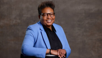 Deanna King, President of the NAACP Corpus Christi Chapter poses in a blue suit.