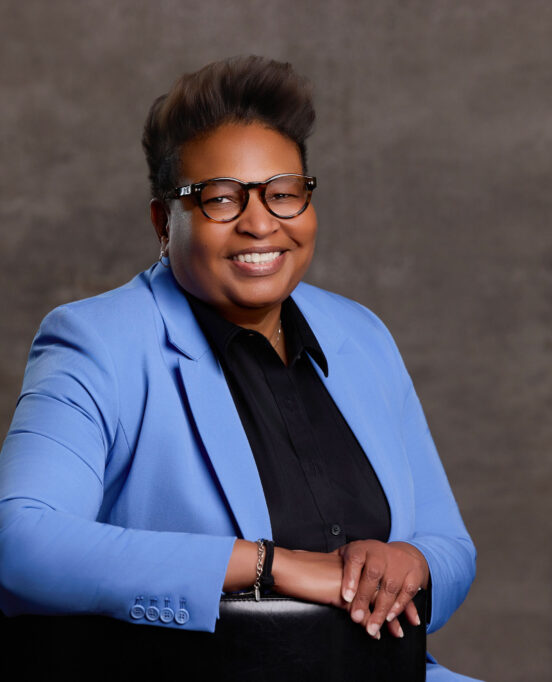 Deanna King, President of the NAACP Corpus Christi Chapter poses in a blue suit.