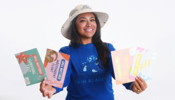Segovia wears Safe and Strong Swim merchandise while holding swim certificates.